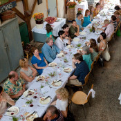 Guests at the community table in the barn